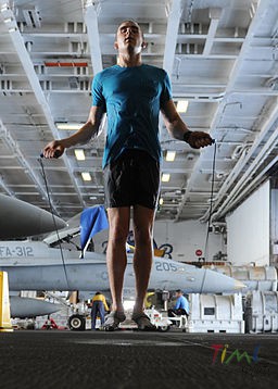 US_Navy_101004-N-6427M-149_Airman_David_Hall,_from_Buffalo,_N.Y.,_jumps_rope_during_a_training_session_in_the_hangar_bay_aboard_the_aircraft_carrie